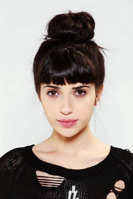 blunt fringes with coiled bun knot hairstyles