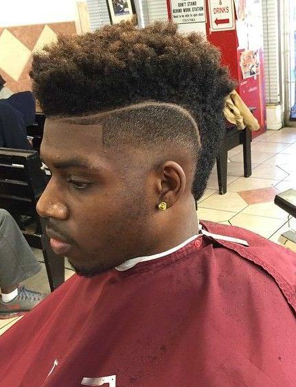 Curly mohawk taper fade with designs cuts for men